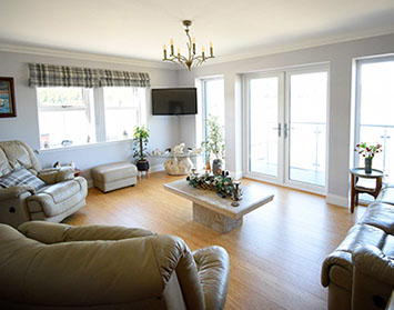 Stay in a comfortable guest living room at Heatherfield House Bed and Breakfast Accommodation near Portree