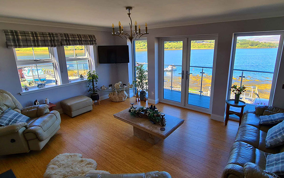 Heatherfield House features a sea view living room with comfortable seating Widescreen TV and WIFI Internet access 