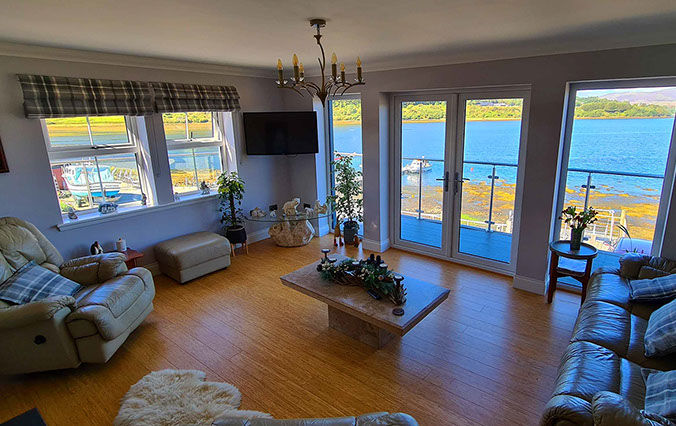 Heatherfield House features a sea view living room with comfortable seating Widescreen TV and WIFI Internet access 