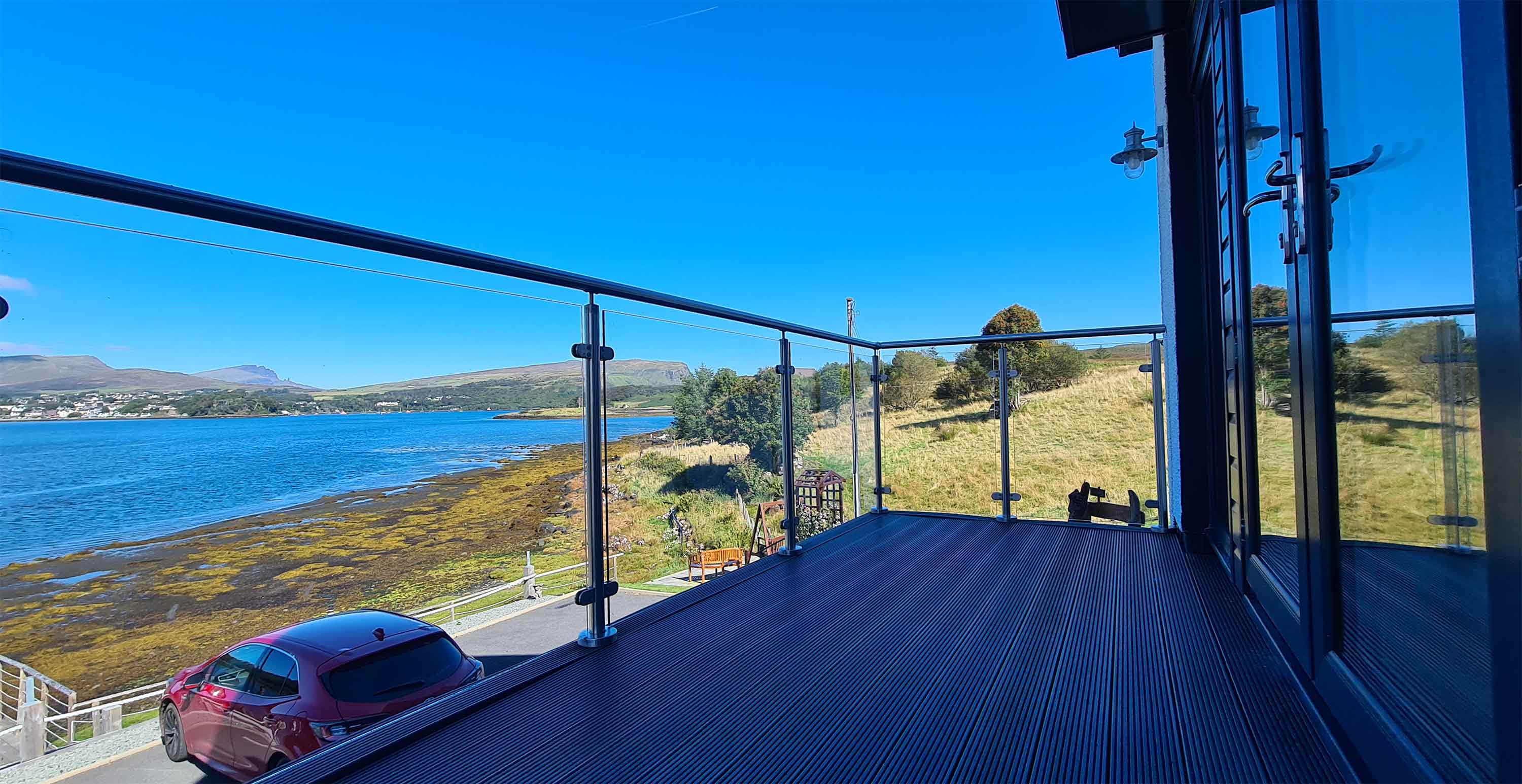 Enjoy Heatherfield House sea view balconys looking towards Loch Portree and The Old Man of Storr